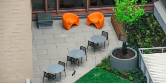 An outdoor patio with seating and tables